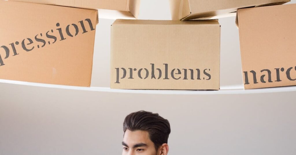 A young man holds a box labeled 'kind' while surrounded by boxes with negative words.