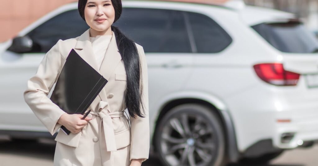 Smiling professional woman standing confidently by a luxury car, embodying success.